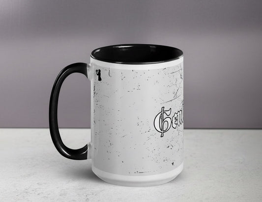White mug with black interior and handle, featuring a logo on a gray background